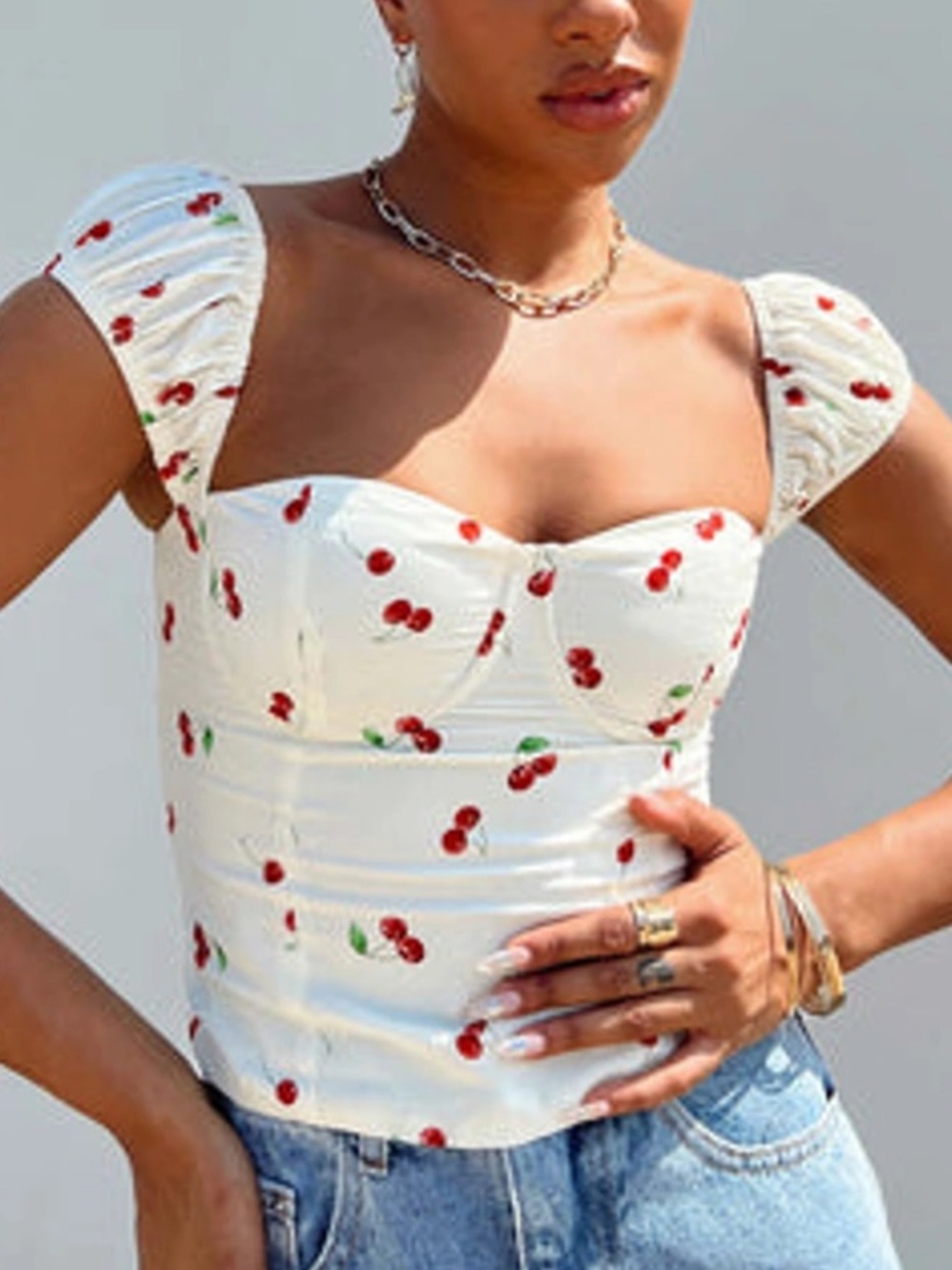 Princess Polly crop top with a red cherry print and ruffled straps size 2